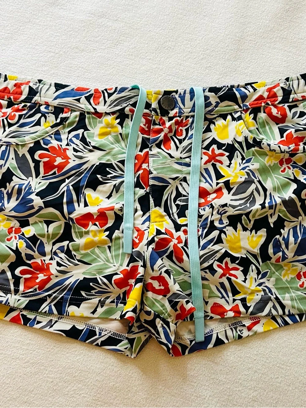 Men’s Steele Swimwear tropical floral swim trunks in size Medium.